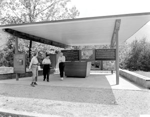 The Cades Cove Orientation Facility (shown here in 1959) was an ideal place to debut the new interpretive materials developed by the Great Smoky Mountains Natural History Association. The box on the left reads, “Use this leaflet free on your Cades Cove tour or if you wish to keep it please put 10¢ in the box.” Provided by GSMNP archives.